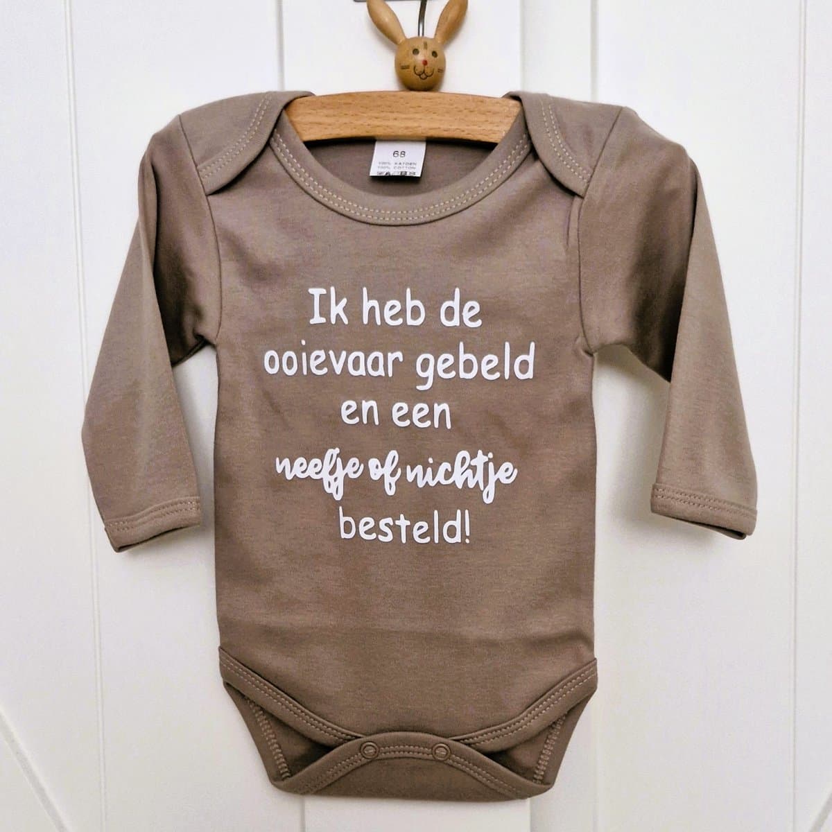romper baby tekst zwangerschaps aankondiging ik word grote neef of nicht ik heb de ooievaar gebeld en een nichtje of neefje besteld beige lange mouw jongen of meisje maat 62-68 (EAN: 7445935156119)