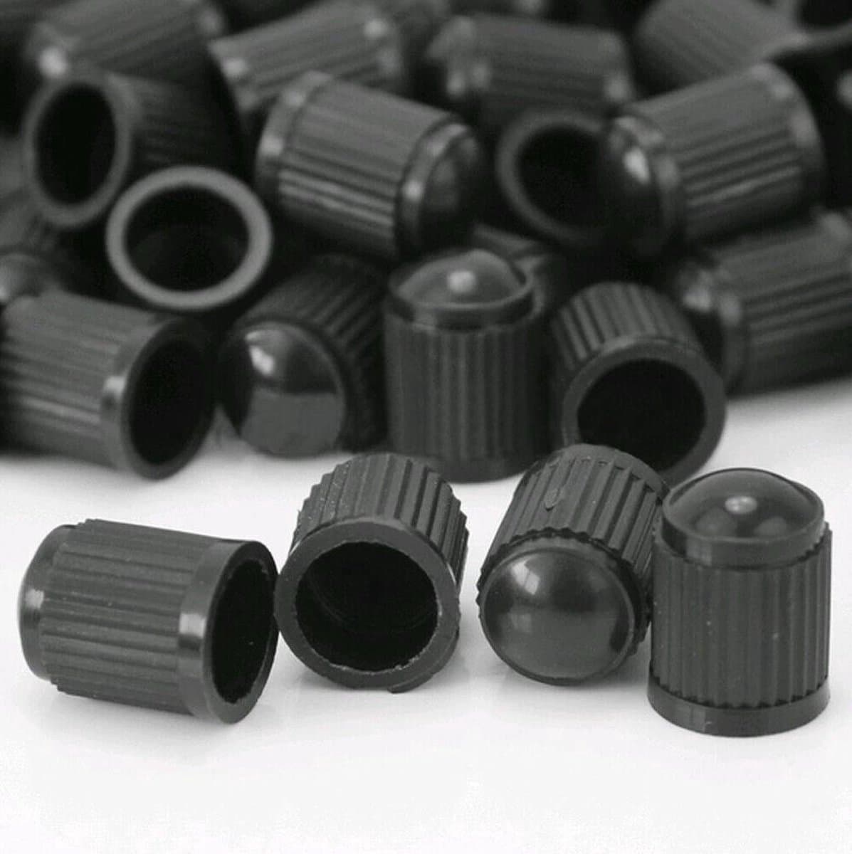 *** Complete set van 4 Universele Zwarte Ventieldopjes Voor De Auto - Kunststof Ventieldoppen - Ventiel dop - Autoventiel - van Heble® *** (EAN: 8720909505261)
